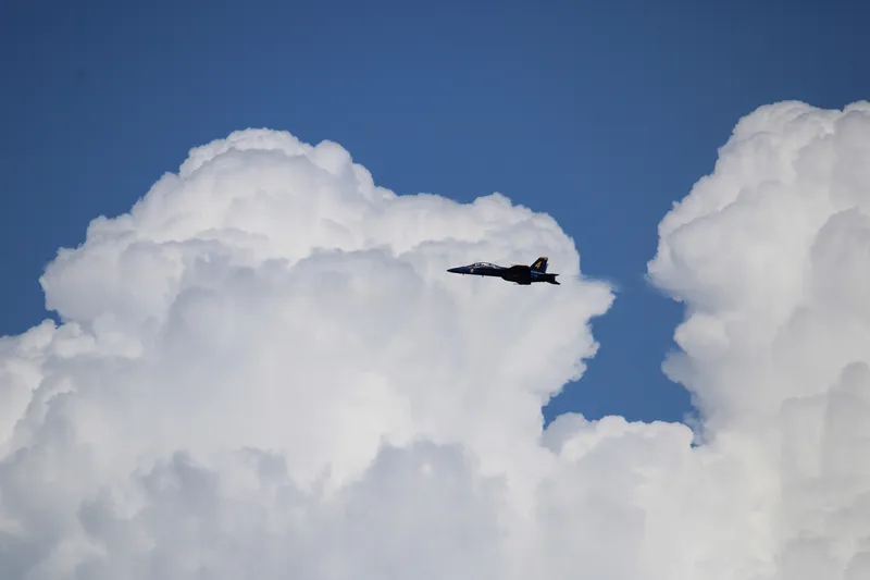 Hornet over cumulus
